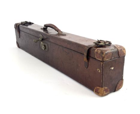 A late 19th/early 20th century leather bound gun case, Westley Richards &amp; Co Ltd, the carcass covered in tooled leather, 