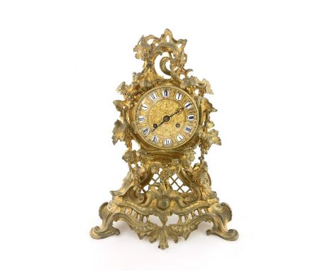 Raingo Freres, a mid 19th century French ormolu and gilt brass mantel clock, relief moulded Rococo form, the gilt embossed 4 