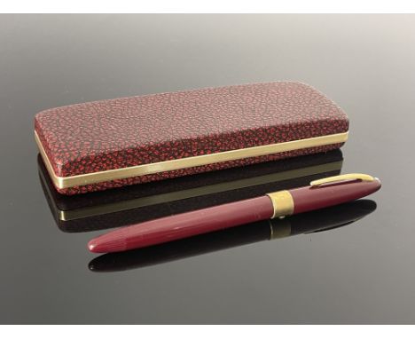 Sheaffer, a Statesman Snorkel fountain pen, red burgundy with gold trim and 14 carat gold nib, in original box