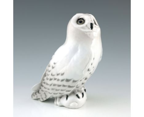 A Royal Copenhagen model of a snowy owl with rabbit, 23cm high