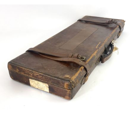 A late 19th/early 20th century leather bound gun case, Bofs &amp; Co London, the carcass covered in tooled leather, stitched 