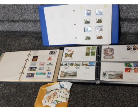 2 albums of stamps from around the world together with album of first day covers