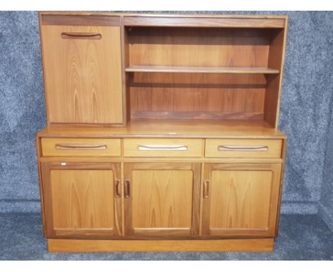 A G-Plan teak sideboard with glass shelf, in two parts 142 x 141 x 44cm.