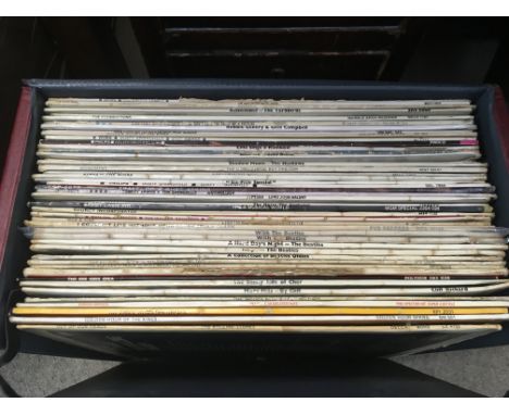 A record case of LPs by artists from the 1960s including The Beatles, The Rolling Stones, Yardbirds and others.