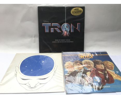 A sealed and mint limited edition 180g pressing of the original 'Tron' soundtrack on LP together with two Doctor Who records 