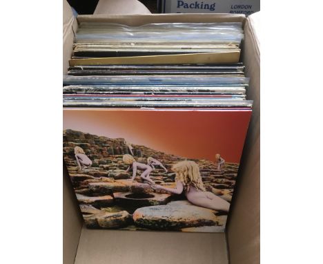 A collection of over fifty rock LPs and 12inch singles by various artists including Led Zeppelin, The Beatles, Roger Waters, 