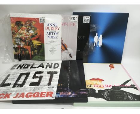 Two bags containing two Rolling Stones CD box sets, a numbered U2 'Songs Of Experience' deluxe edition plus four LPs by vario