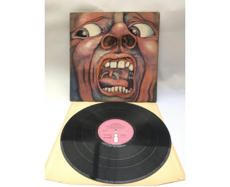 A first UK pressing of 'In The Court Of The Crimson King' by King Crimson, ILPS 9111. Vinyl is VG+, small hairline scratches 