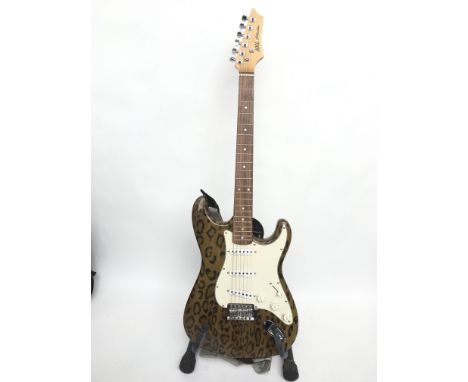 An AXL Strat style electric guitar with leopard print finish and fitted with three EMG single coil pickups. Comes supplied wi