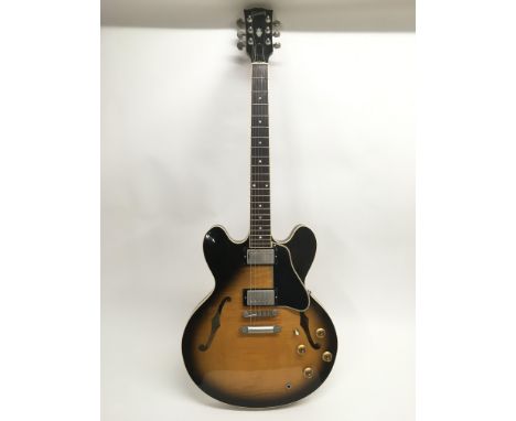 A 1997 Gibson ES335 electric guitar, serial number 92387371. Guitar is in a very good condition and comes supplied with it's 