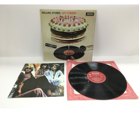 A first UK mono press of The Rolling Stones LP 'Let It Bleed' complete with poster, condition Ex. Comes together with two ear