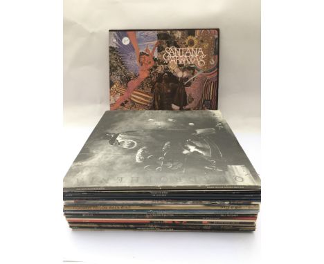 Two bags containing a collection of LPs by various artists including The Who, Slade, David Bowie and others.
