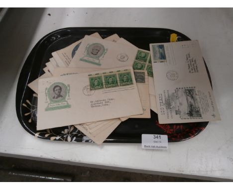 tray of vintage stamps envelopes