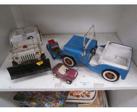 shelf of vintage tin toys