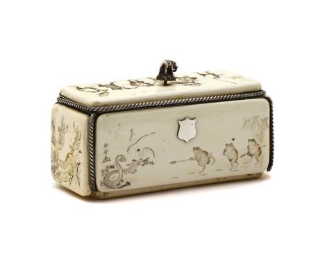 A Japanese carved ivory and silver mounted box, late 19th century, the detachable lid and back carved with comic processions 