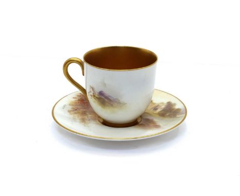 A Royal Worcester porcelain cabinet cup and saucer, signed Rushton, painted with a mountain top castle, cup 5cm high, saucer 