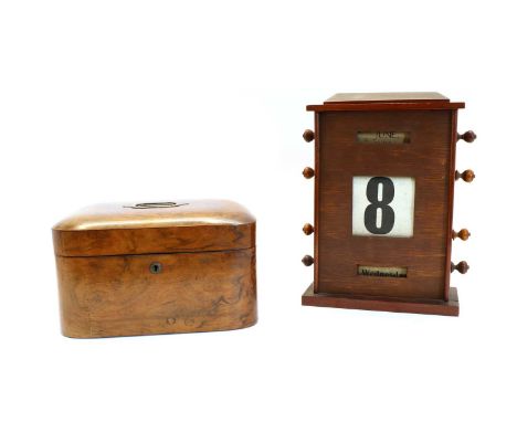 A Victorian walnut work box, with inset handle enclosing a buttoned interior, with mirrored lid, 31cm wide, 22cm deep, 19cm h