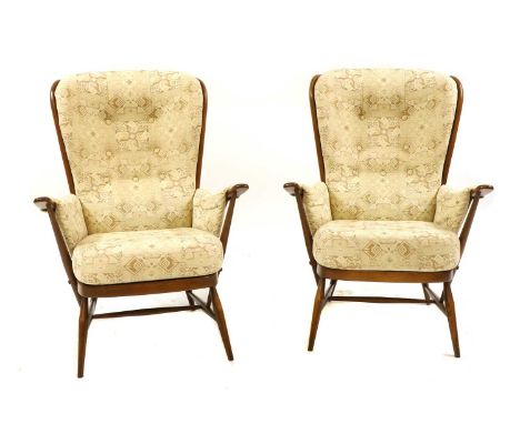 A pair of Ercol 'Evergreen' high-back armchairs, 74cm wide, 84cm deep, 107cm high (2)Condition report: Good overall. Used con