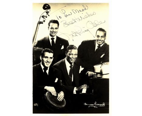COLE NAT KING: (1919-1965) American Jazz Singer & Pianist. Vintage signed and inscribed sepia 5 x 7 photograph of Cole seated
