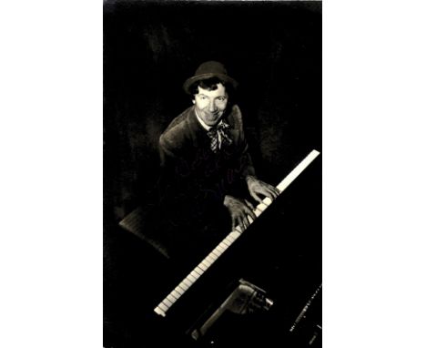 MARX CHICO: (1887-1961) American Film Comedian, one of the Marx Brothers. Vintage signed postcard photograph of Marx seated i