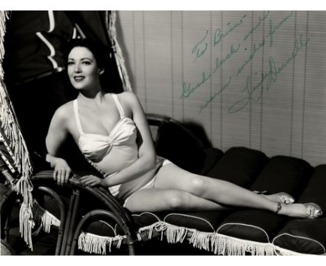 DARNELL LINDA: (1923-1965) American Actress. Vintage signed and inscribed 8.5 x 6.5 photograph, a glamorous full length study