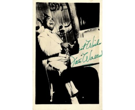 WALLER THOMAS 'FATS': (1904-1943) American Jazz Pianist. Vintage signed postcard photograph of Waller seated in a full length