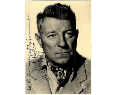 GABIN JEAN: (1904-1976) French Actor. Vintage signed and inscribed 4 x 6 postcard photograph of Gabin in a head and shoulders