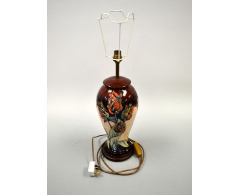 A MOORCROFT TUBE LINED LAMP, Red Tulip pattern, approximately 45cm high