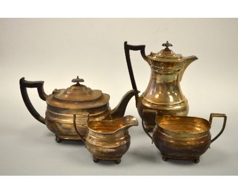A FOUR PIECE SILVER TEA SERVICE, on bun feet, comprising teapot, milk jug and sugar bowl Sheffield 1934 with Jubilee mark, to