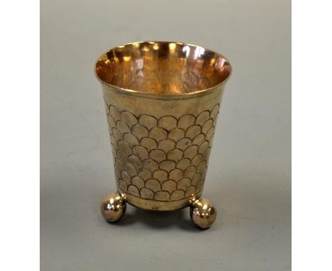 A SCANDINAVIAN ? SILVER BEAKER, of tapering form with scale decoration on three ball feet, approximately 8cm high, approximat