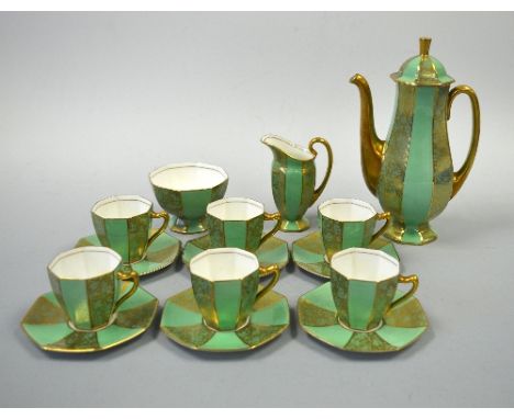 A 1930'S ROYAL DOULTON COFFEE SERVICE, decorated with gilt floral detail to green ground, comprising six coffee cans and sauc