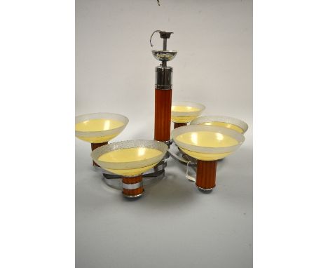 AN ART DECO CHROME AND BUTTERSCOTCH BAKELITE THREE BRANCH CEILING LIGHT, together with two matching demi lune wall lights, wi