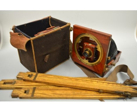 A THORNTON PICKARD SANDERSON CAMERA, junior model, with mahogany case and brass mounts, in felt case with six double slides a