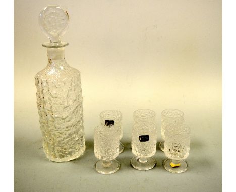 A WHITEFRIARS CLEAR GLASS CYLINDRICAL BARK EFFECT DECANTER, together with similar glasses on circular feet, decanter approxim