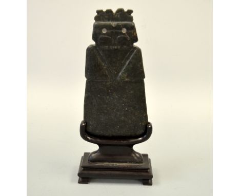 A JADE STYLE ORIENTAL CEREMONIAL AXE HEAD, with carved stylised bird ? Detail set on hardwood stand, axe approximately 24cm x