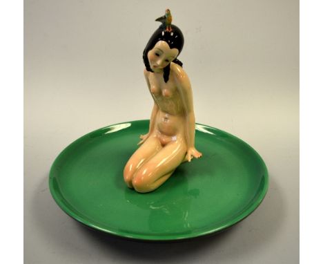 A LENCI FIGURE, modelled by Helen Koening Scavini depicting kneeling nude maiden with bird perched on head set on circular ba