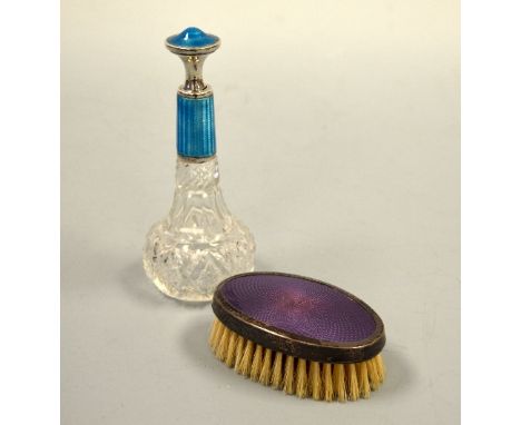 A CUT GLASS SCENT BOTTLE, with blue enamel collar and stopper, together with purple enamel and silver backed oval brush, scen