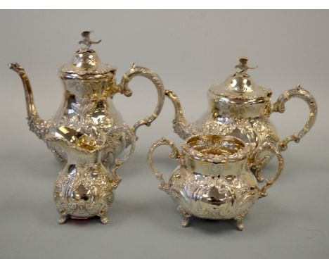 A SILVER FOUR PIECE TEA SERVICE, of bulbous form with embossed floral and leaf decoration, vacant cartouches, teapot and hot 