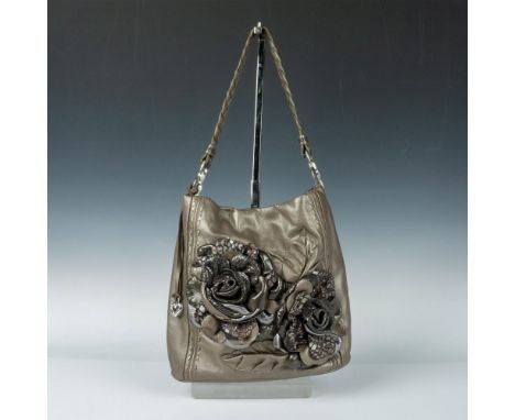 Magnetic top closure opens to fabric lining and additional zippered pockets. Metallic Grey-Bronze colored leather exterior wi