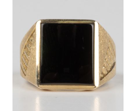 This gorgeous ring has an engraved 24k yellow gold band with a large square onyx center stone. It is marked 24k EMI inside th