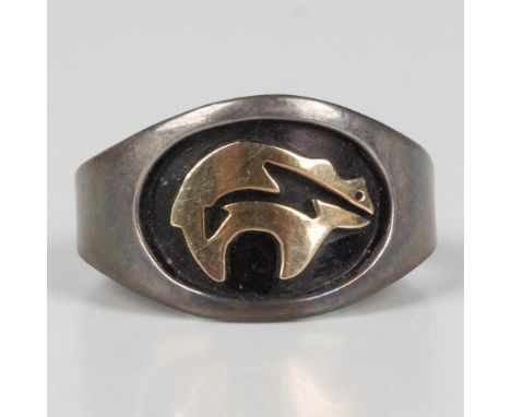 This gorgeous Southwestern Native American tribal ring was designed in 14k yellow gold and sterling silver by M.M. Rogers and