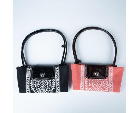 Two canvas bags in salmon and black decorated with floral and vine design. Button closure with top zipper and double leather 