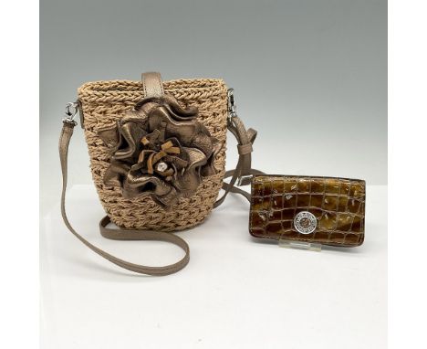Small straw bag with bronze patent leather floral button closure and clip-on shoulder strap. Interior has fabric lining with 