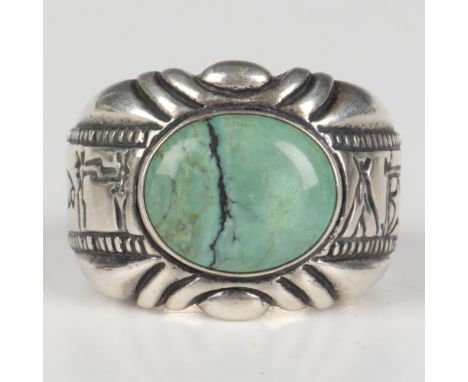 Native American style ring with a carved sterling silver band and turquoise stone. Carolyn Pollack and sterling silver hallma