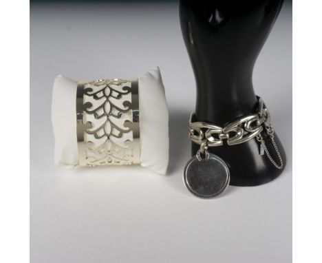 Silver toned linked bracelet with round disk to monogram and clasp closure 7"L - Monet impressed mark. Cuff bracelet with cut