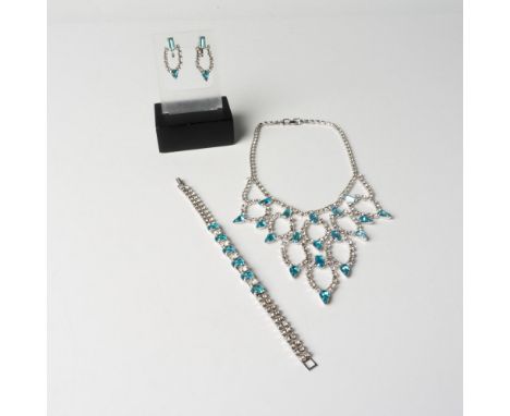 Silver tone necklace, bracelet, and screw-back earrings with brilliant clear and light blue rhinestones. The earrings are not