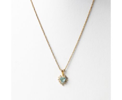 This vintage gold tone necklace features a beautiful heart pendant set with crystals. Dimensions: 18"LCondition: Age related 