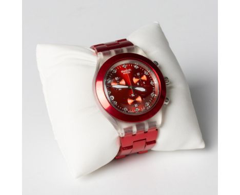 This watch has a translucent plastic case with a red aluminum bracelet. There is a fixed red PVD bezel and red face with lumi