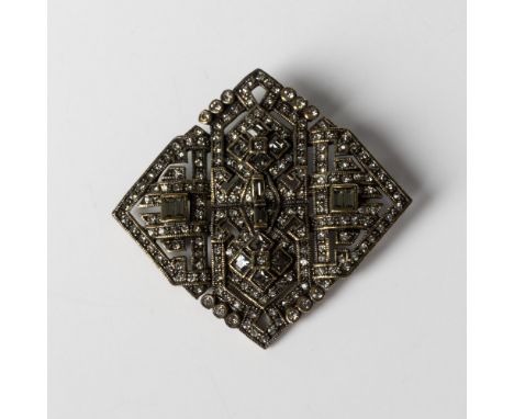 Gorgeous bronze metal diamond-shaped brooch/pendant set with smoky gray crystals. It has both a pin and bail on the back with