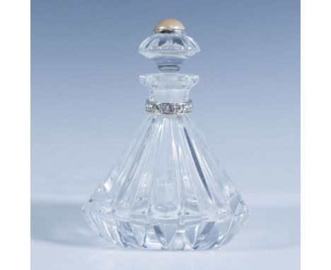 Beautiful crystal triangular bottle with stopper and decorated with brilliant crystal collar. This item has its original box 